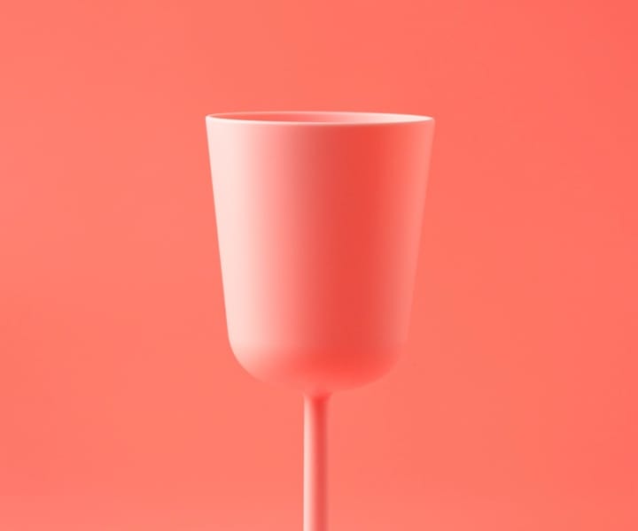 Image of a pink cup over a pink backdrop